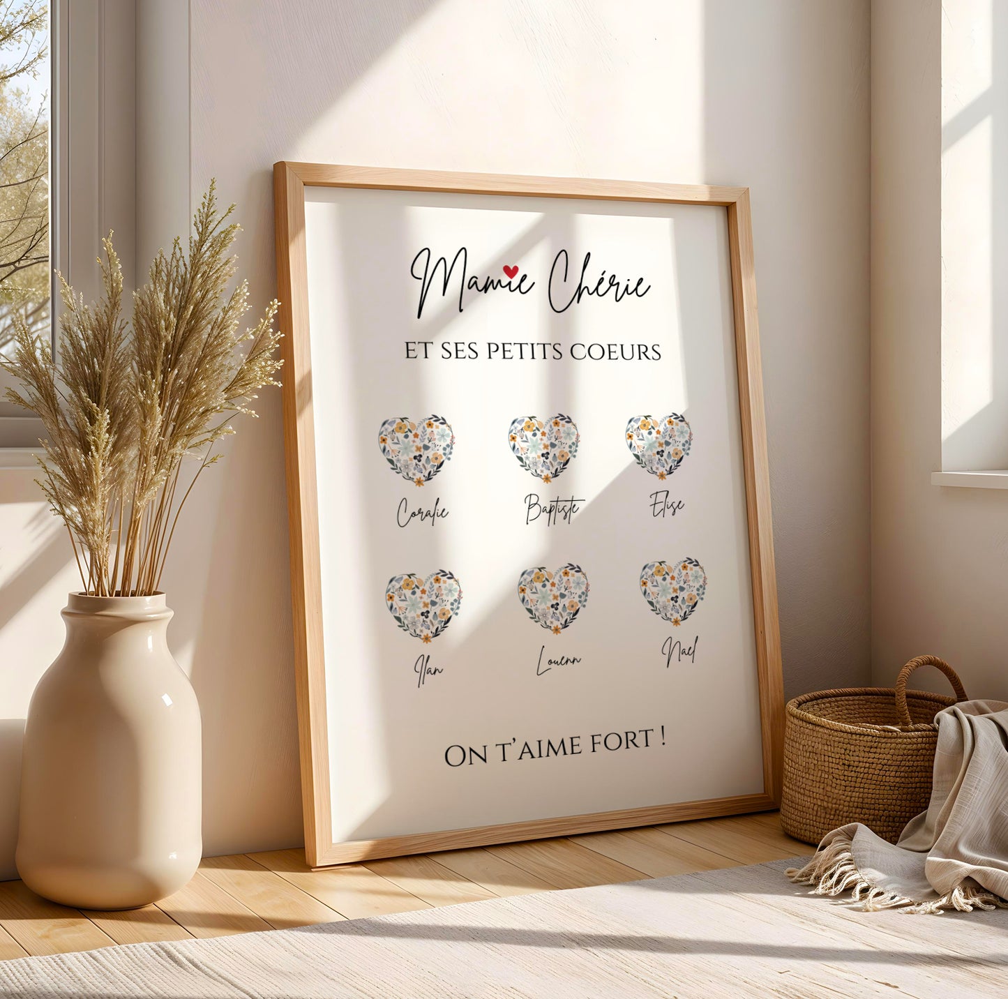 Affiche Mamie Personnalisée with grandchild names in heart shapes, framed, soft neutral decor, Fête des Grands-Mères gift.
