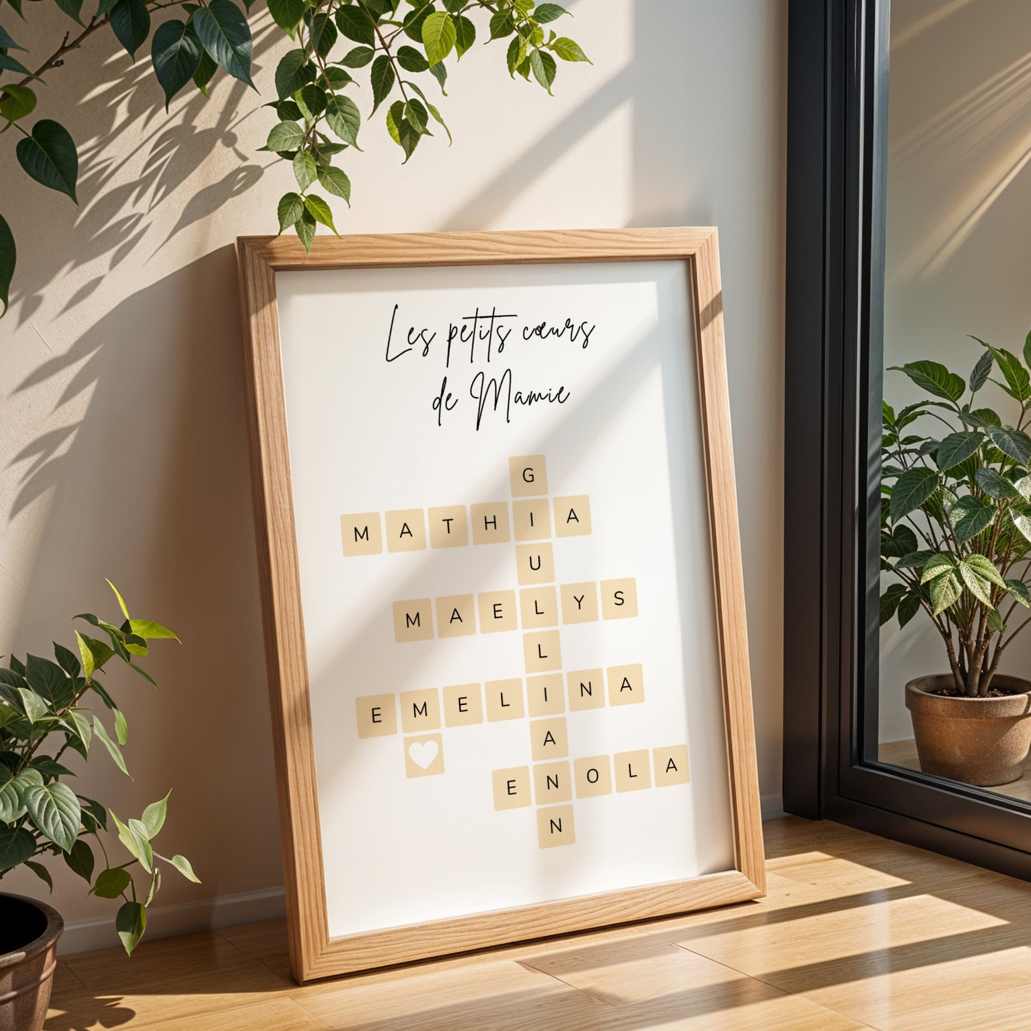 Affiche Mamie Personnalisée with grandchild names in scrabble tile design, framed wooden A4 poster for Fête des Grands-Mères.