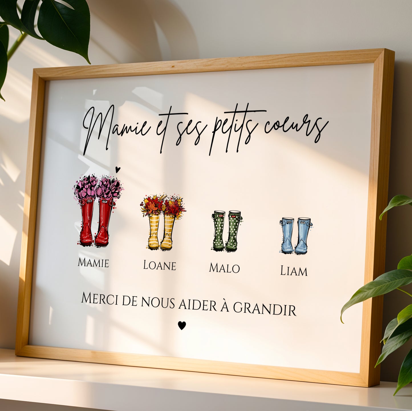 Affiche Mamie Personnalisée with colorful rain boots and family names in wooden frame for Fête des Grands-Mères.