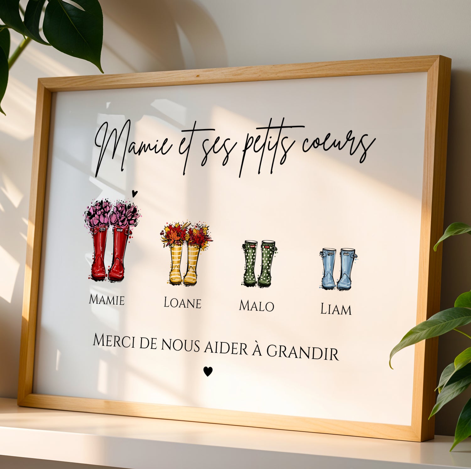 Affiche Mamie Personnalisée with colorful rain boots and family names in wooden frame for Fête des Grands-Mères.