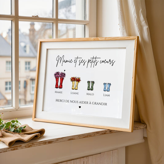 Affiche Mamie Personnalisée with colorful rain boots illustration and Fête des Grands-Mères message in wooden frame.