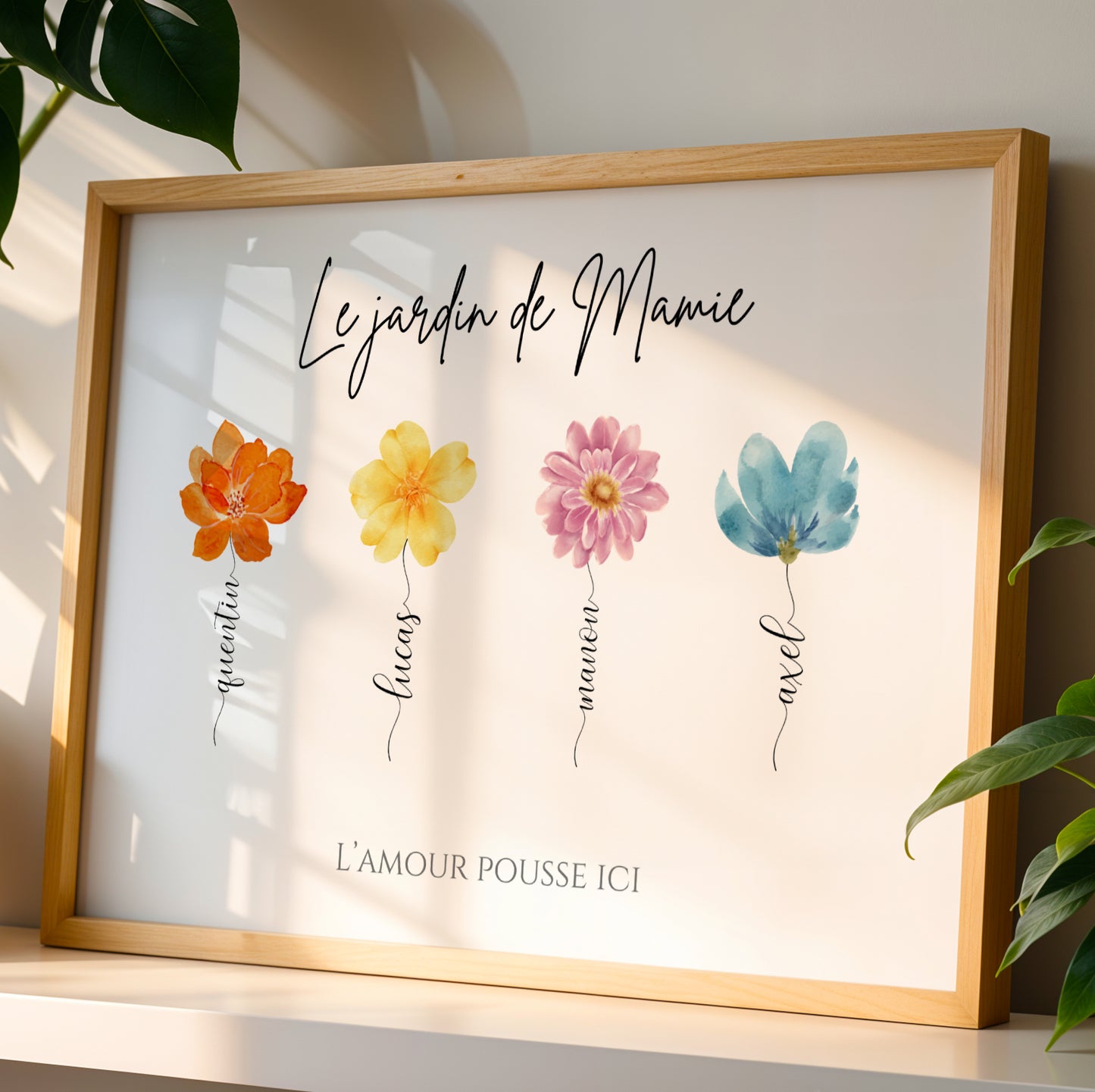 Framed personalized "Affiche Mamie" with colorful flower illustrations and "Fête des Grands-Mères" text.