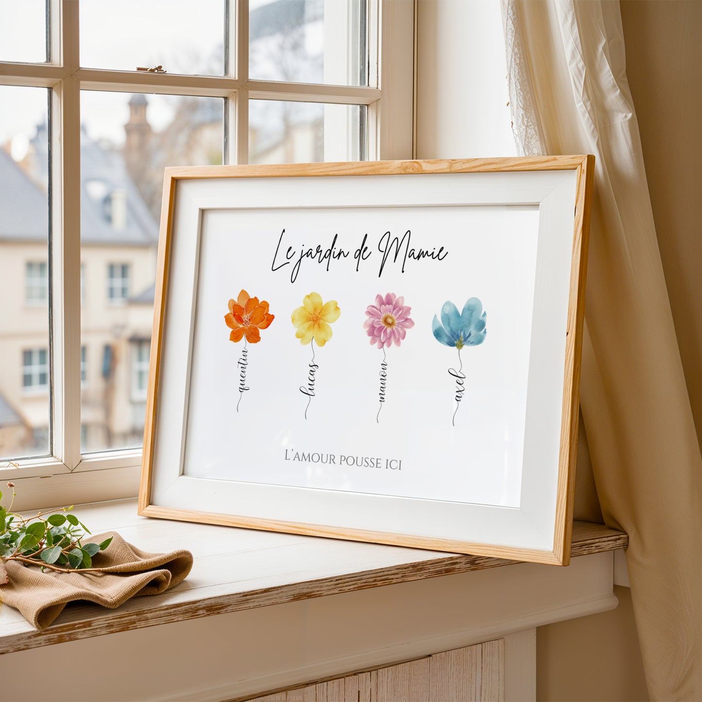 Framed personalized Affiche Mamie with colorful floral design and names, perfect for Fête des Grands-Mères gift.