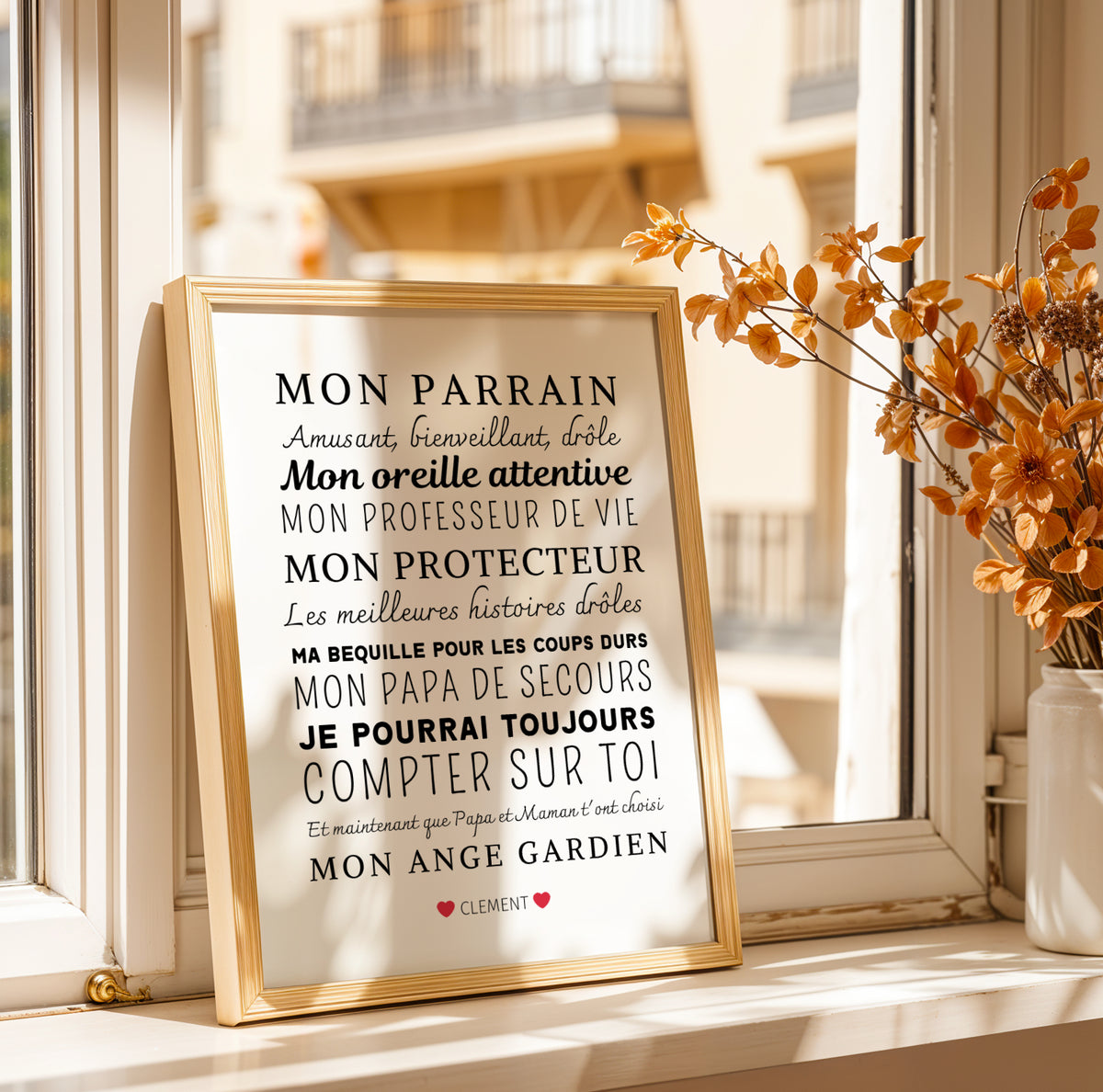 An Affiche Personnalisée Mon Parrain | Demande et Cadeau Unique pour Parrain - Le Temps des Paillettes sits on the windowsill by dried orange flowers, sunlight highlighting its heartfelt French message—a perfect, thoughtful cadeau parrain.